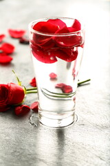 Traditional Indian rose water on  rustic backgroound.