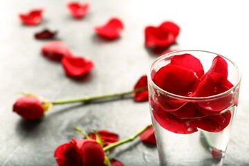 Fototapeta na wymiar Rose petals infused water on a beautiful background.