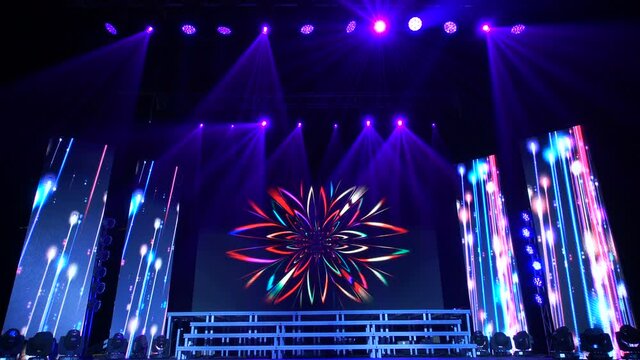Animation of stage lights frame. Bright shiny stage lights flashing movement entertainment spotlight projectors in the dark, blue soft light spotlight strike on black background.