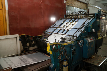 An old industrial machine for making an impression. Mold, indentation and application of a thin...
