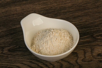 Wheat flour heap in the bowl