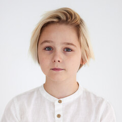 shoulder portrait of eleven years old kid, young blond boy