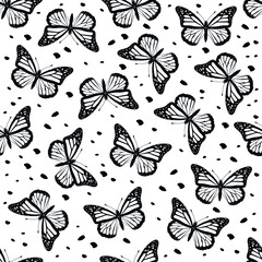 Beautiful butterflies on a seamless pattern. Print design in black background