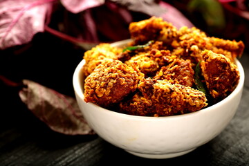 Bowl of spicy crispy fried broasted chicken,