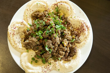Humus on the white plate
