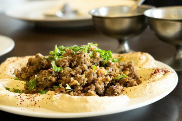 Humus on the white plate