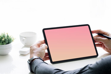 Cropped shot of man hand holding blank screen portable tablet.