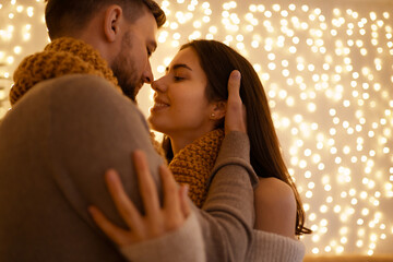 Two lovely sweet tender beautiful adorable cute romantic couple enfolding in one snood celebrating...