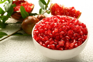 Bowl of organic sweet ripe pomegranate seeds. healthy diet food.