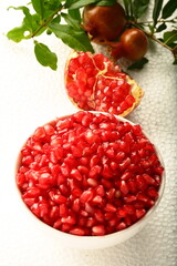 Bowl of organic sweet ripe pomegranate seeds. healthy diet food.