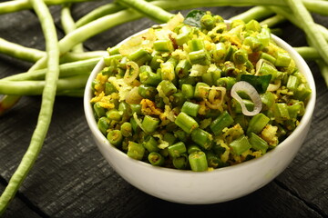 bowl of delicious homemade beans thoran from Kerala cuisine,  green bean stir fry with coconut and spices.