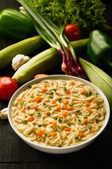 Spicy noodle soup with exotic spices and herbs,