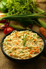 Homemade delicious chicken noodles soup with organic spices and herbs.