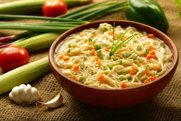 Homemade delicious chicken noodles soup with organic spices and herbs.