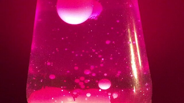 pink Lava lamp closeup 70s style pink lava liquid background stock footage with copy space bright pacific pink 