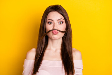 Photo of optimistic brunette lady play wear pink shirt isolated on yellow color background