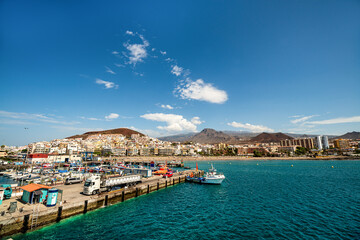 Naklejka na ściany i meble Los Cristianos city on the island Tenerife from a ship. Canary Islands.