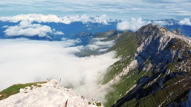 Timelapse of the fast moving clouds in the mountain valley