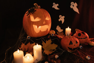 Halloween Decoratins on Table. Halloween Pumpkin. Traditional Treats.