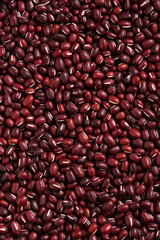 Raw adzuki red bean as background with spoon.
