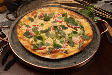 Brazilian pizza with pepperoni, cheese & arugula
