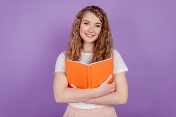 Photo of inspired clever student lady hands embrace book love story wear casual outfit on purple background
