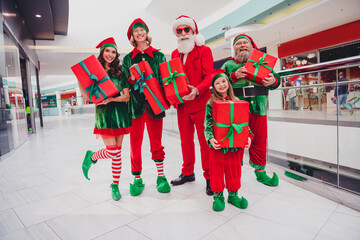 Portrait of attractive cheerful funny friends elfs holding giftboxes festal time bargain shopaholic...