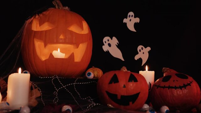 Halloween Decoratins on Table. Halloween Pumpkin. Traditional Treats.