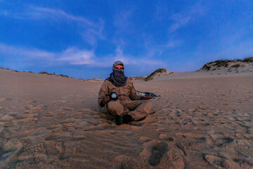 Terrorist in the desert with drone and camera. Concept of prosecution for blogging and fake...