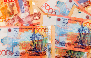 Banknotes of Kazakhstan Coins Money Kazakhstan Tenge as a background, a lot of money coins for one tenge five thousand