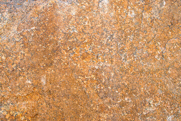 Raw rough yellow golden brown granite texture background. Natural rock stone texture background. Granite Grades. Muscovite colored minerals in granite