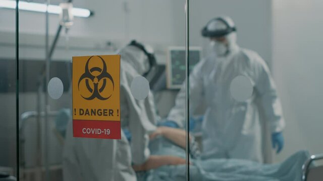 Hospital ward in coronavirus quarantine with danger sign. Lockdown area with symbol of hazardous symbol against pandemic outbreak. Patient with virus symptoms in isolation zone.