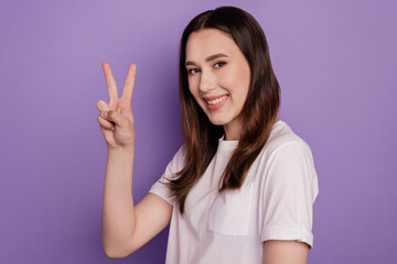 Profile side photo of young girl happy positive smile show peace cool v-sign isolated over violet color background