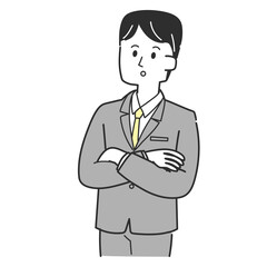 考え事をしているスーツの男性