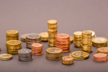 Coins Money US dollars and Euros on a gray background, different monetary coins