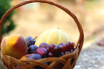 Vintage basket filled with various fruit. Selective focus.
