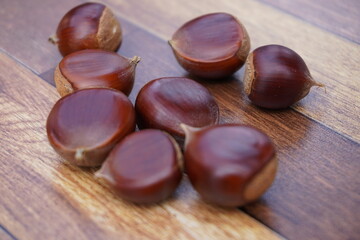 The chestnuts are just picked up and sparkle. The chestnuts look really delicious.