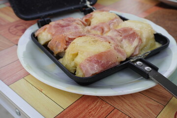 German potatoes are cooked in a hot sandwich maker (HSM), and the brown bacon and melty cheese are the best.