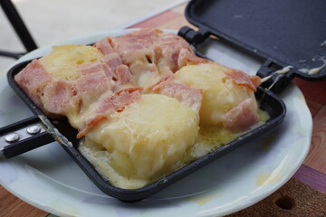 German potatoes are cooked in a hot sandwich maker (HSM), and the brown bacon and melty cheese are the best.