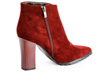 Burgundy female leather warm boots isolated on white background.