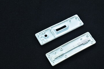 inside of antigen test kit for checking virus on black background

