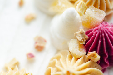 Vegan ginger cake filled with rhubarb and ginger jam with a rhubarb flavour frosting. Covered in rhubarb flavour frostings, candied ginger pieces and freeze dried rhubarb pieces