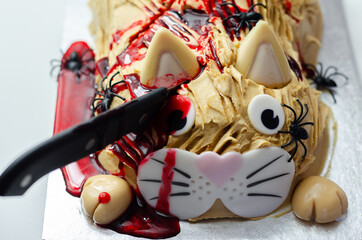 Halloween cake cat, layered biscuit cake in the shape of a kitty decorated for Halloween party