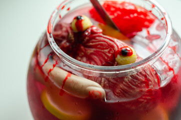 Punch prepared for Halloween party with decorative elements stylized as human organs