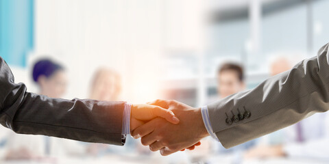 Partnership concept. Image of handshake . Mixed media