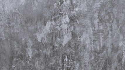 The old cement wall was weathered, the surface was scratched, the surface was scratched and damaged. For a mysterious retro-conservative background.
