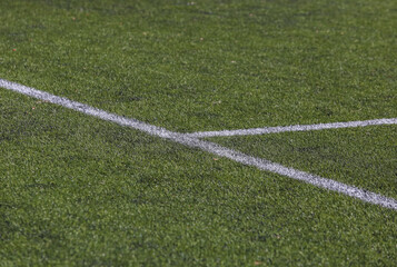 Obraz premium white marking strip on a soccer field with