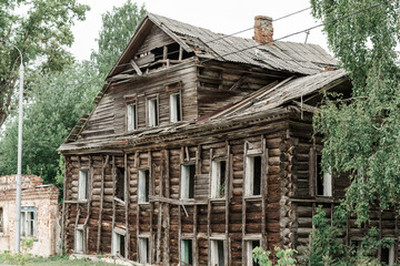 old, wooden, multi-storey, destroyed wooden house