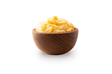Ghee or clarified butter in wooden bowl, cooking oil, pure ghee isolated on white background. Clarified butter with copy space for text on white.