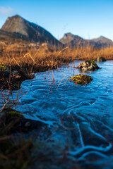 Frozen water in the Norwegian mountains in autumn
